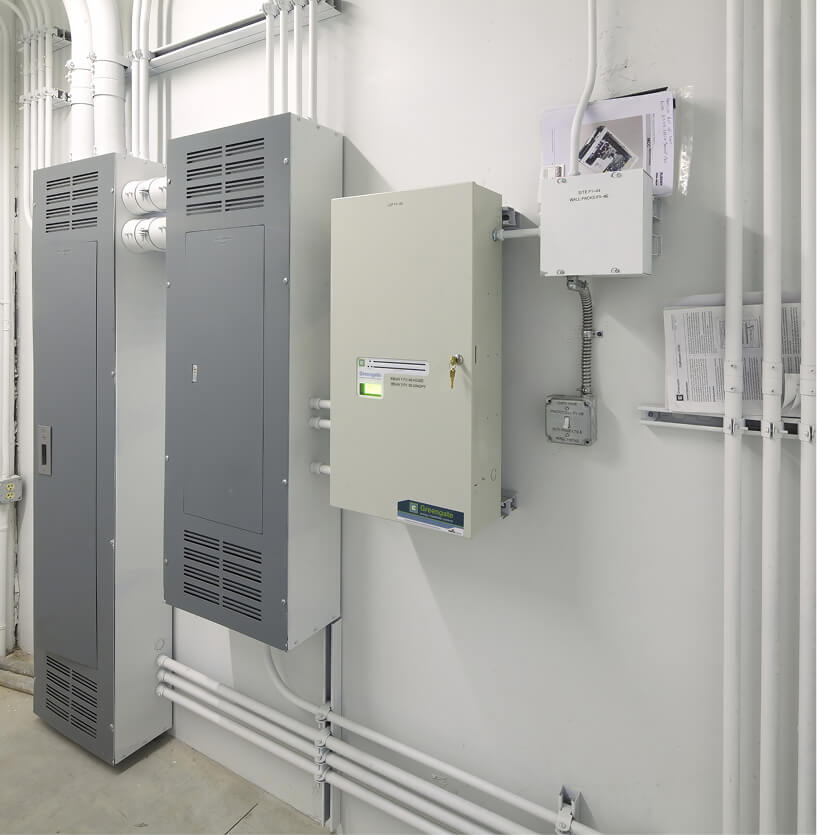 Industrial electrical panel and power distribution equipment mounted on a utility room wall